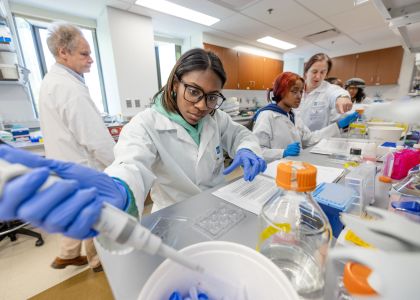 students in lab processing samples